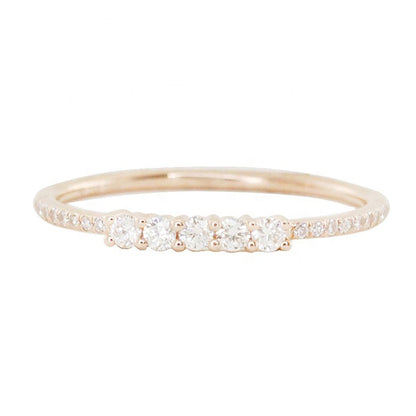 Detailed shot of white rose gold finished for Lily ring with cubic zirconia gemstones pave row stack ring 