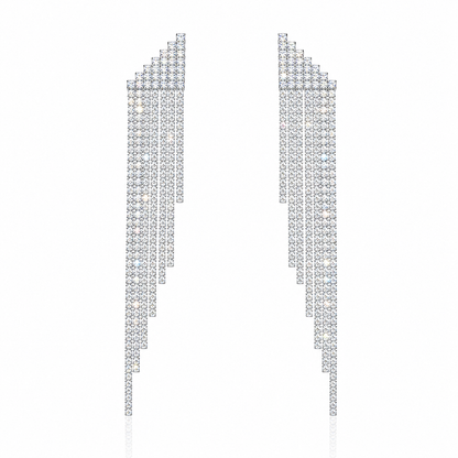 A pair of long, geometric statement earrings made of clear rhinestones arranged in a stepped, triangular pattern, shown on a plain white background.