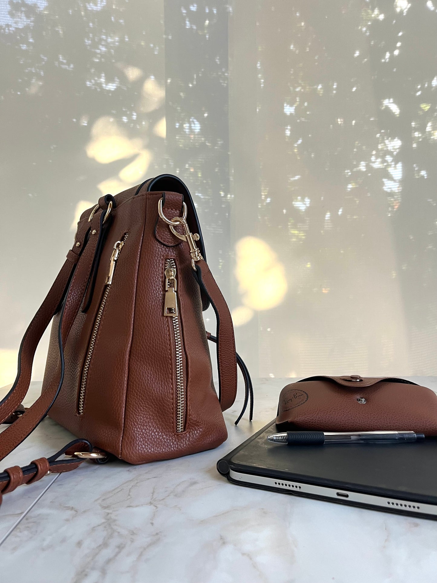Size reference images showcasing compact a small ipad and personal items